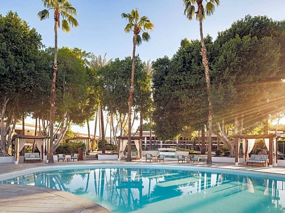 Lagoon-style pool surrounded by palms